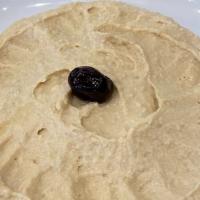 Hummus · Chickpeas mashed into a paste with lemon juice, olive oil and flavored with tahini.