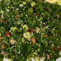 Tabuli · Chopped scallions, parsley, tomatoes, bulgur, olive oil and lemon juice.