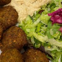 Falafel With Humus (7) · Lightly fried vegetable balls made of chickpeas with celery, garlic parsley, cilantro served...