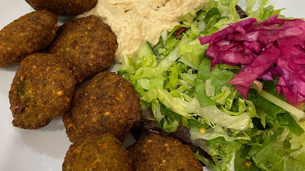 Falafel With Humus (7) · Lightly fried vegetable balls made of chickpeas with celery, garlic parsley, cilantro served with tahini sauce.