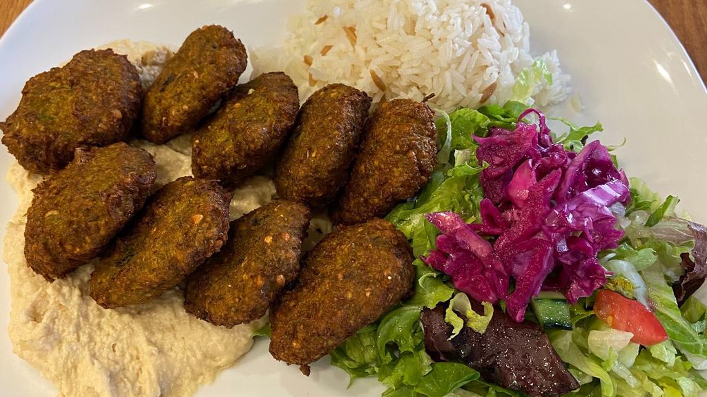 Dinner Falafel Plate (9) · Lighlty fried vegetable balls made of chickpeas, celery, garlic, parsley, cilantro, tahini. Served with humus, rice and salad.