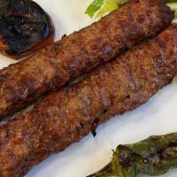 Adana Kebab · Ground lamb flavored with red bell peppers slightly seasoned with paprika ang grilled delici...