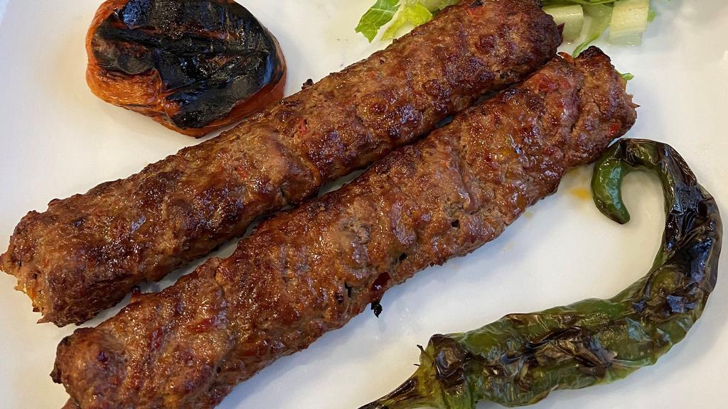 Adana Kebab · Ground lamb flavored with red bell peppers slightly seasoned with paprika ang grilled deliciously on skewers.
