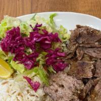 Gyro / Doner · Layers of marinated ground meat, wrapped around the large vertical split and grilled in fron...