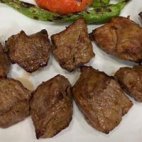 Lamb Shish Kebab · Lean cubes of lamb marinated and grilled over a charcoal fire.