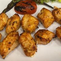 Chicken Shish Kebab · Tender chunks of chicken marinated with chefs' own blend of herbs & spices.