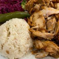 Chicken Gyro · Layers of marinated chicken thigs wrapped around the large vertical split and grilled in fro...