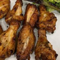 Chicken Wings · Marinated chicken wings grilled to your taste.
