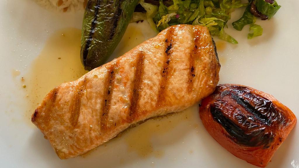 Grilled Salmon  · Cubes of char-grilled salmon served with salad and rice.