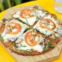 Cauliflower Pizza · Cauliflower crust (Vegan)(GF), Marinara Sauce, Mozzarella, Market Vegetables. Contains dairy