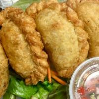 Curry Puff · Puff stuffed with ground chicken, potatoes, onions, and curry powder served with cucumber sa...