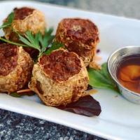 Hoi Jor · Fried crab meat, shrimp, water chestnuts wrapped in dried bean curd sheet served with plum s...