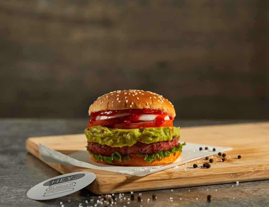 Healthy Burger · Beyond burger on a sesame bun topped with lettuce, tomatoes, white onions, pickles, ketchup, and guacamole