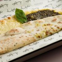 Za'Atar · A special blend of thyme, sumac, and sesame seeds baked on our flatbread. Vegan.