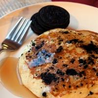 Oreo Pancakes · 3 buttermilk pancakes with crumbled Oreo cookies sprinkled on top and powdered sugar  comes ...