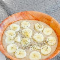 Oatmeal Loaded · A Delicious bowl of oatmeal with bananas raisins brown sugar topped with hemp seeds and chia...