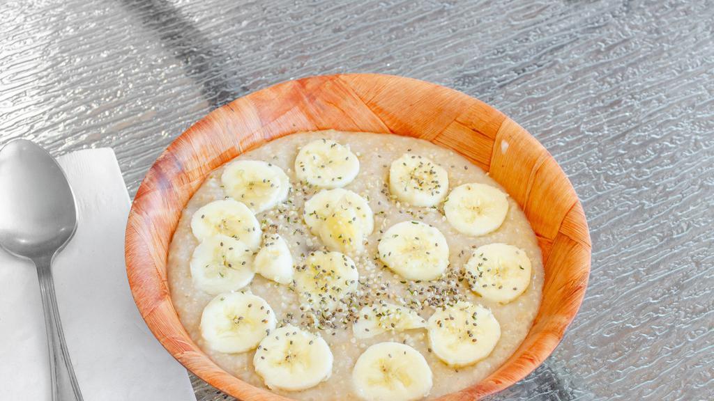 Oatmeal Loaded · A Delicious bowl of oatmeal with bananas raisins brown sugar topped with hemp seeds and chia seeds