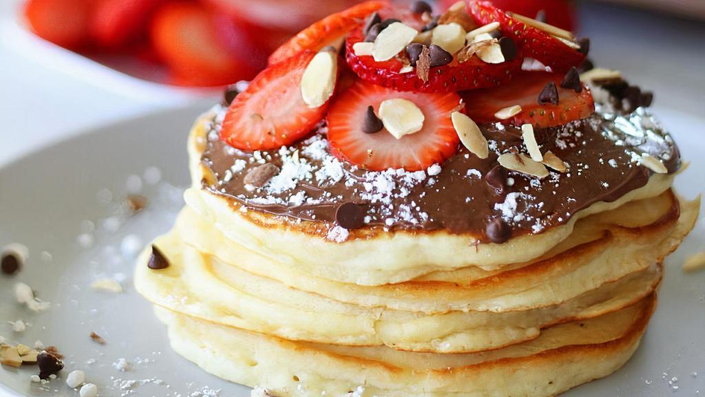 Nutella Pancakes · 3 buttermilk pancakes topped with Nutella and powdered sugar and comes with syrup and butter yummy !