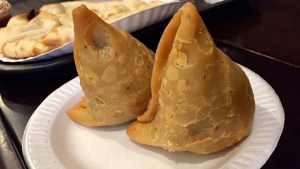 Chicken Samosa (2 Pieces) · Minced chicken wrapped in a crispy patty.