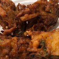 Vegetable Pakora (4 Pieces) · Cauliflower, potatoes, eggplant in a batter of chick pea flour and spices.