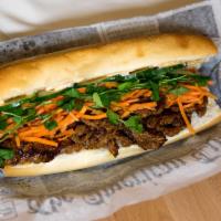 Spicy Lemongrass Steak Sandwich · Our signature lemongrass marinade over flank steak. Generously filled with Asian pickled car...