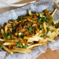 Curry Fries · Enjoy our air-fried fries with our signature curry sauce, chopped green onions and crispy sh...
