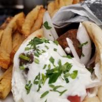 Falafel Souvlaki & Fries · homemade falafel wrapped in a warm pita with tahini yogurt sauce and fries