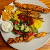 Chicken Skewers · generous cuts of natural chicken breast served with fries and basmati rice