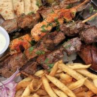 Beef Kebab Platter · hand rolled seasoned ground beef over basmati rice,  tomato herbed sauce, fries
