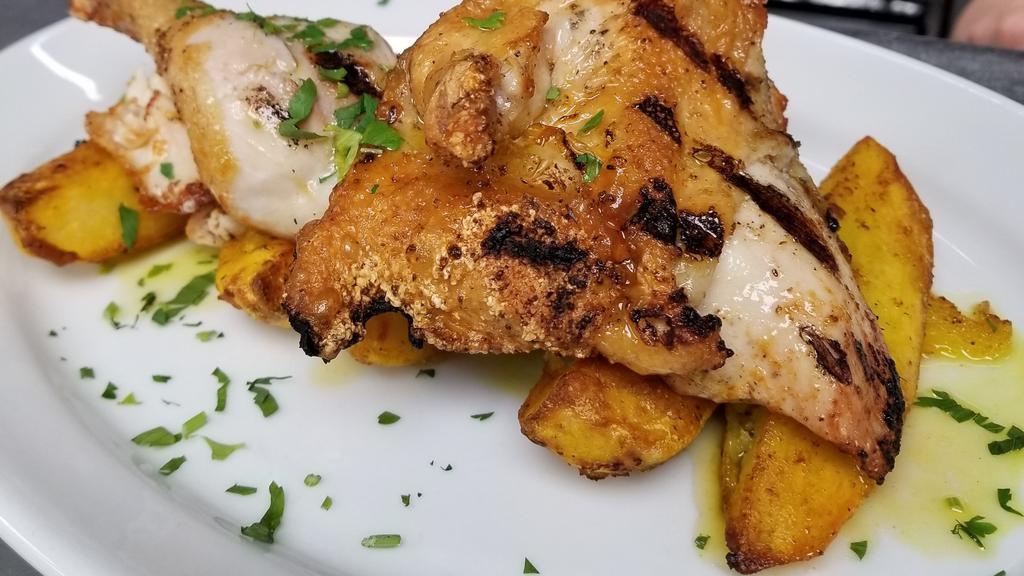 Roasted Chicken · half chicken marinated and served with roasted lemon oregano potatoes