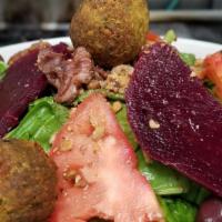 Falafel Bowl · homemade falafel served, chickpeas, kale, spinach, red beets, olives, vine ripe tomatoes and...