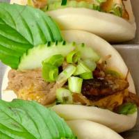 Thai Pulled Pork Buns  · Slow cooked pulled pork in Thai herbs, cucumber, scallion, basil and spicy mayo sauce