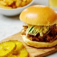 Thai Pulled Pork Sandwich  · An American favorite dressed in Thai!
Slowly roasted for 8 hours, this tender and juicy pull...
