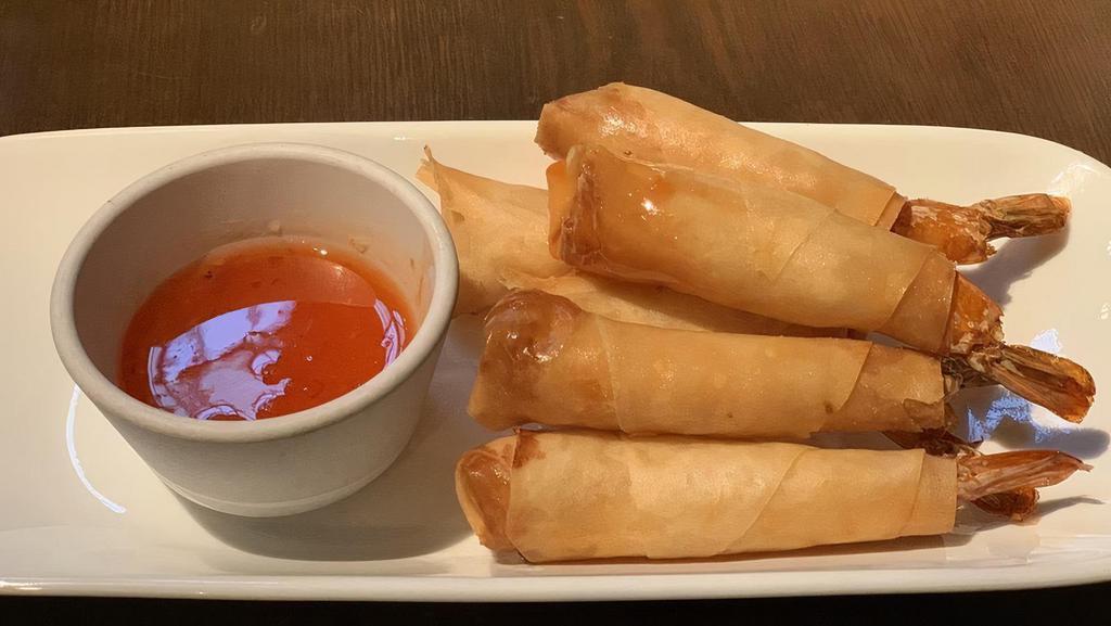 Shrimp Roll · Whole shrimp in an egg roll with honey chili sauce.