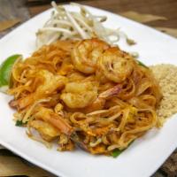 Pad Thai · Sautéed rice noodles in a lime/tamarind sauce with egg, bean sprouts, scallion, crushed pean...