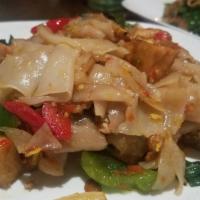 Pad Kee-Mao (Drunken Noodles) · Broad rice noodles, chicken, and shrimp, stir fried with onion, bell pepper, Thai basil, chi...