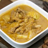 Massaman Chicken  · Mild, coconut based, rich, brown curry with flavors of baking spice. Onion, peanuts and pota...