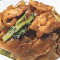 Vegan Pad See-Ew · Sautéed rice noodles in a browned soy sauce with egg, Chinese broccoli and tofu.