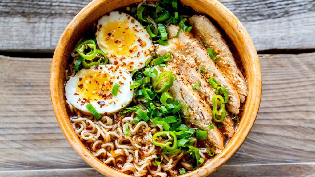 Chicken Ramen · Rich savory pork broth, fresh chicken, fish cakes, bamboo shoots, and a soft egg on a bed of ramen noodles.