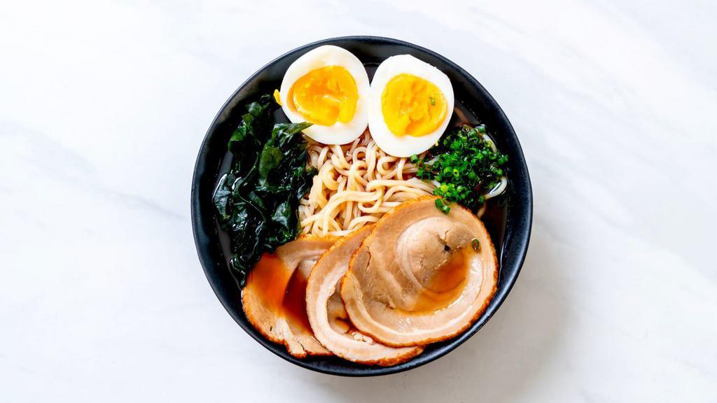 Pork Ramen · Rich savory pork Broth, pork, fish cakes, bamboo shoots, and a soft egg on a bed of ramen noodles.
