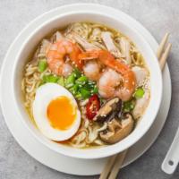 Shrimp Ramen · Rich savory pork broth, shrimp, fish cakes, bamboo shoots, and a soft egg on a bed of ramen ...
