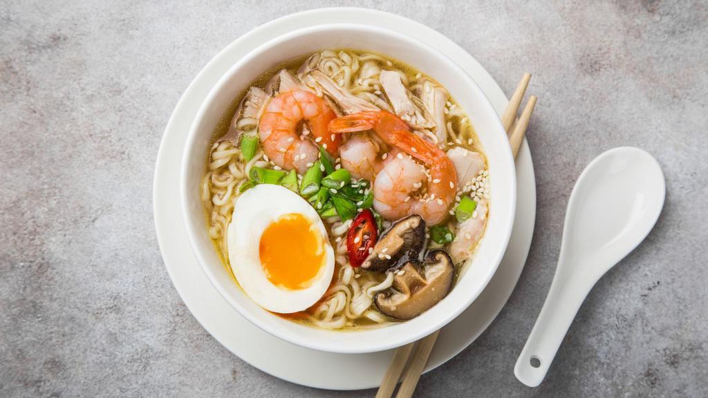 Shrimp Ramen · Rich savory pork broth, shrimp, fish cakes, bamboo shoots, and a soft egg on a bed of ramen noodles.