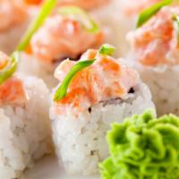 Spicy Salmon Roll · Spicy salmon and seaweed wrapped in rice.