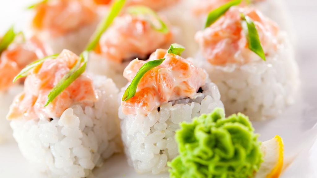 Spicy Salmon Roll · Spicy salmon and seaweed wrapped in rice.
