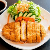 Chicken Katsu · Crispy breaded chicken served over rice with a choice of miso soup or house salad.