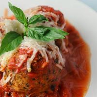Vegan Meatball Appetizer · Two of our homemade, delicious vegan meatballs topped with marinara sauce and Daiya vegan ch...
