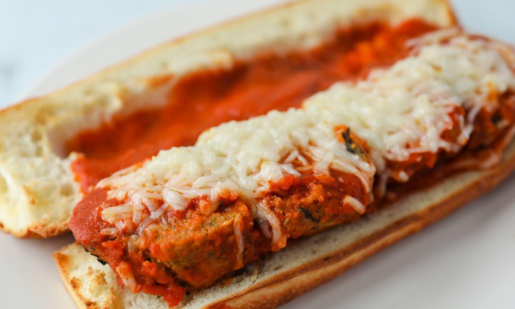 Vegan Meatball Parm Hero · Our homemade meatless meatballs on our homemade Italian bread with Daiya vegan cheese and tomato sauce.
