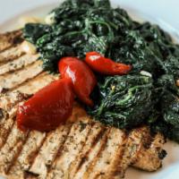 Chicken And Spinach · Grilled chicken breasts served with spinach.