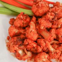 Buffalo Cauliflower · Cauliflower tossed in a spicy vegan buffalo sauce. Served with a side of pasta or salad. Add...
