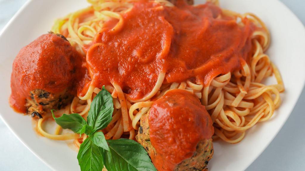 Vegan Pasta With Our Homemade Meatless Meatballs · Vegan. Three of our homemade, delicious  meatless meatballs over pasta topped with marinara sauce.